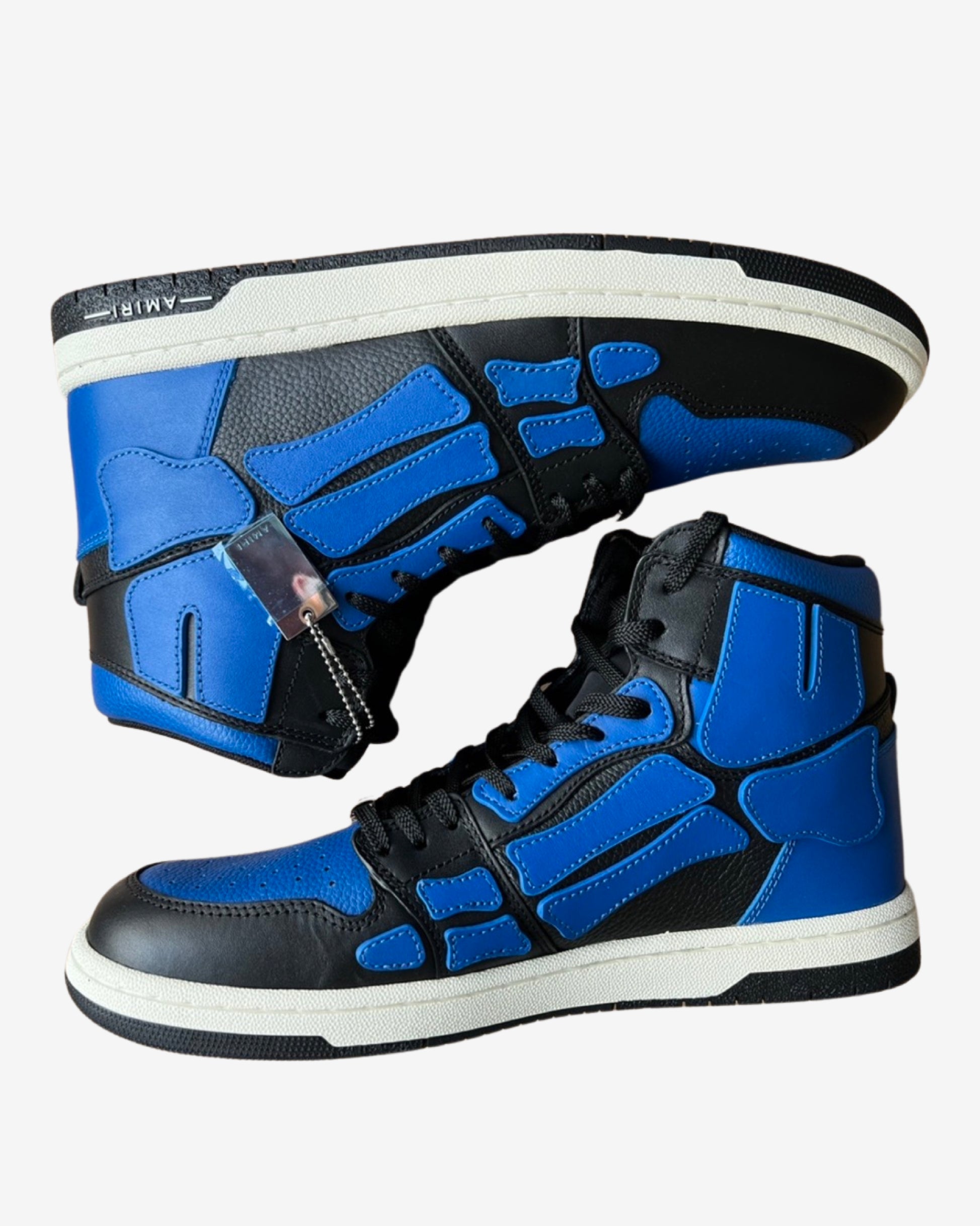 pair of black and blue amiri skel high sneaker